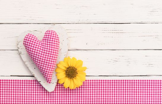 Valentines day pink heart with blossom on white wood background