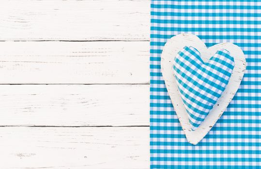 Baby boy birthday greeting card background with blue heart and copy space

