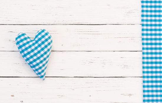Baby boy birthday greeting card background with blue heart and copy space

