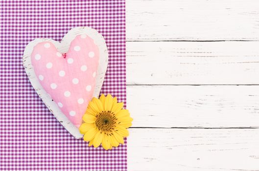 Romantic pink heart with blossom on white wooden background with copy space