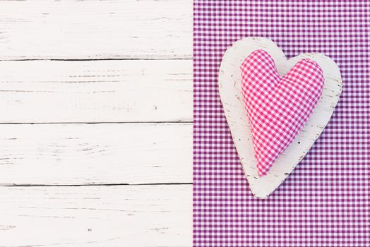 Romantic pink heart on white wood background for Valentine card with copy space