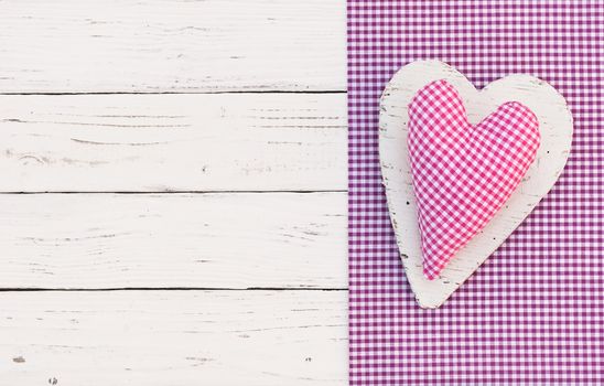 Pink fabric heart background for Mothers day with copy space