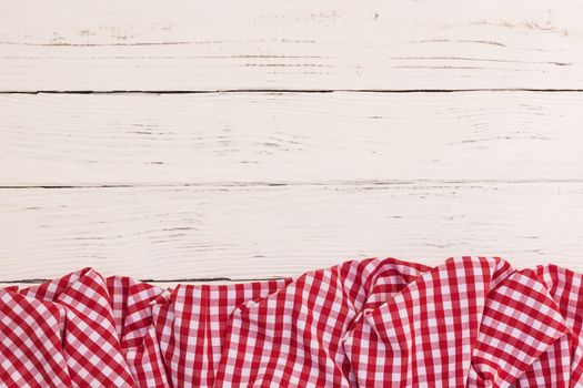 White wooden table background rustic texture, with red checkered tablecloth, high angel view