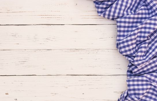 White wooden table background rustic texture, with blue checkered tablecloth, high angel view