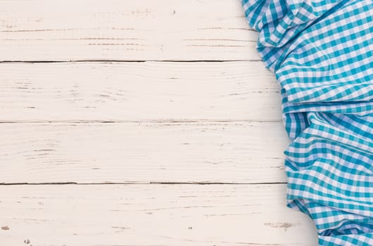 White wooden table background rustic texture, with blue checkered tablecloth, high angel view