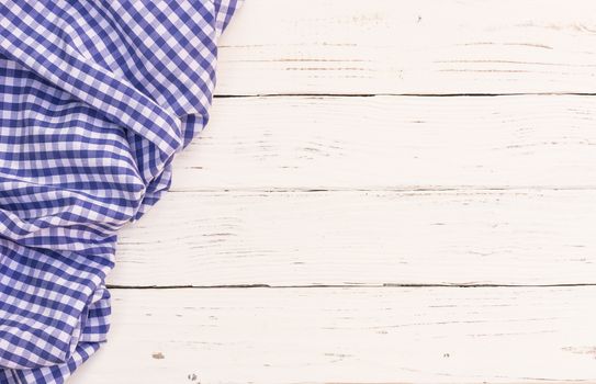 White wooden table background rustic texture, with blue checkered tablecloth, high angel view