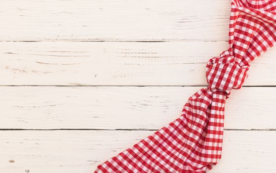 White wooden table background rustic texture, with red checkered tablecloth, high angel view
