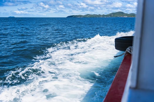 Water blue ocean splash and boat in the sea way ,Waves splashing on the side of ship