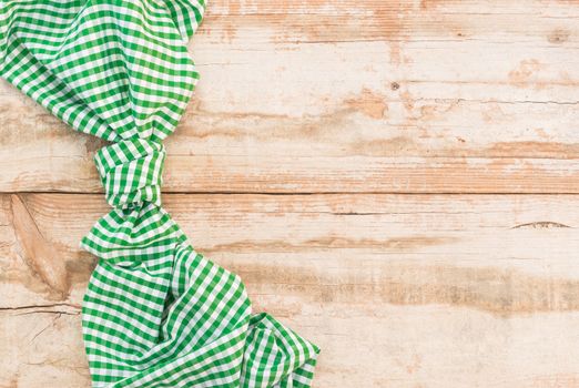 Wooden table background rustic texture, with green checkered tablecloth, high angel view