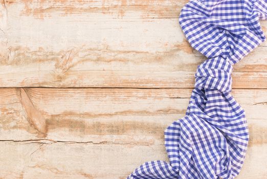 Wooden table background rustic texture, with blue checkered tablecloth, high angel view