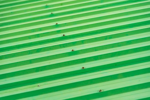 Green painted metal roof as an abstract background