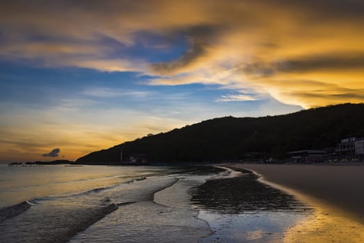 Chon Buri, Thailand - June, 28, 2020 :  Pictures of Tawaen Beach in the dawn, the sun was rising, morning sunrise  time on Koh Lan island after the outbreak of the Covid 19 virus.