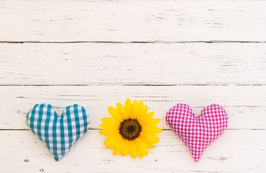 Blue and pink heart and yellow flower for romantic Valentine day background with copy space