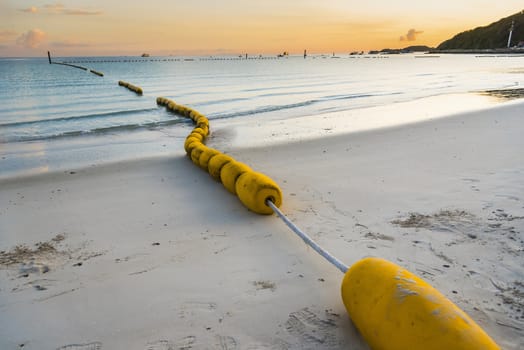 buoyancy on the beach, sign warning dangerous.