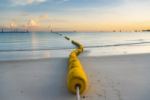 buoyancy on the beach, sign warning dangerous.