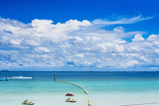 The pictures of clear skies and beautiful clouds and the beach during the day time