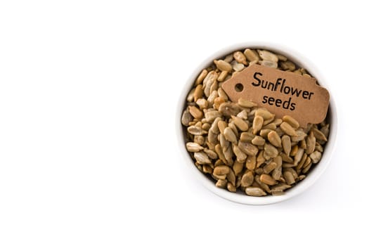 Sunflower seeds in bowl isolated on white background