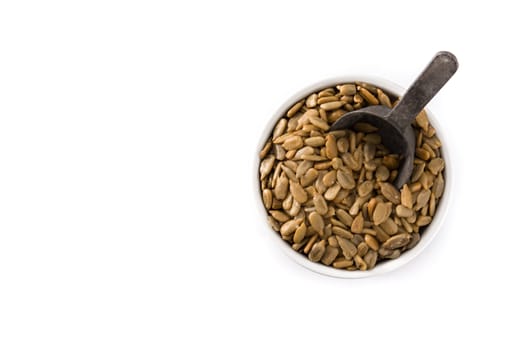 Sunflower seeds in bowl isolated on white background