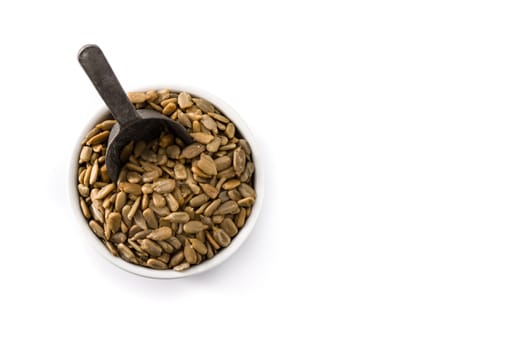 Sunflower seeds in bowl isolated on white background