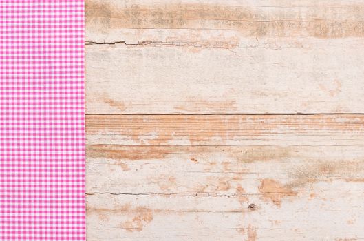 Table background with rustic pink tablecloth