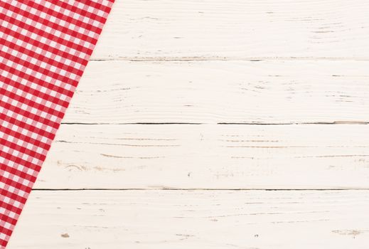 White table background with rustic red tablecloth, high angle view
