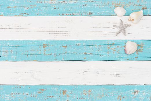 Maritime decoration with sea star and seashells on wooden background with copy space