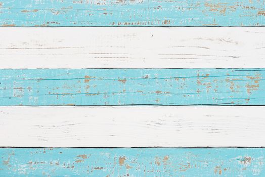 Wooden background texture of white and light blue colored planks
