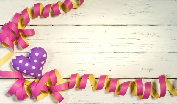 Streamers with heart decoration on white background for party or birthday celebration