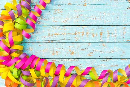 Celebration background with multicolored streamers decoration and copy space