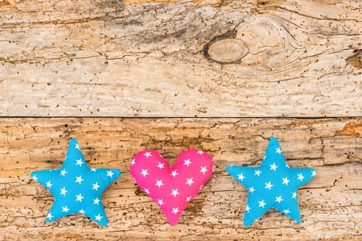 Stars and heart decoration on vintage wooden background with copy space