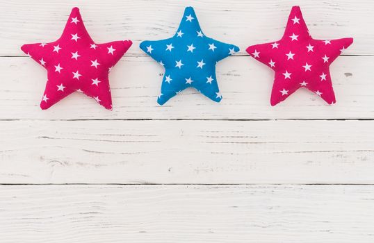 Fabric stars on white background with copy space