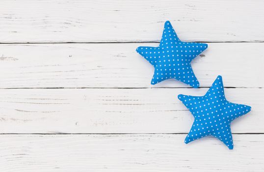 Blue stars decoration on white wood with copy space