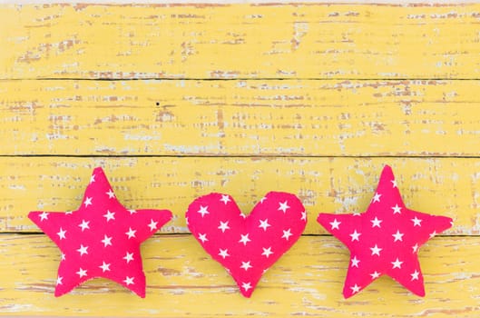 Background with heart and stars on rustic wood with copy space