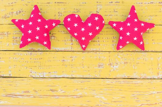 Stars and heart decoration on vintage wooden background with copy space