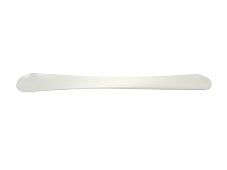 White plastic spoon spatula use to mix on fruit shake