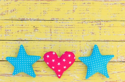 Stars and heart decoration on vintage wooden background with copy space