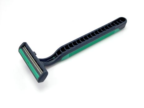 Disposable plastic green and black body manual shaver with blade attach to the head