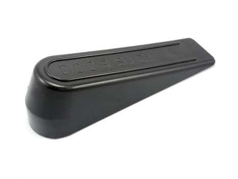Black hard inclined plastic door stopper with ridges use to put underneath the door