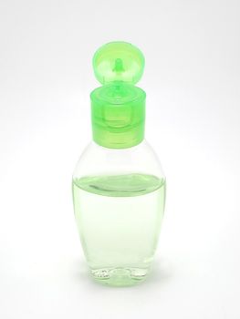 Clear liquid hand sanitizer in plastic bottle use to rub both hands 