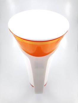 Orange and white color long plastic drinking cup with handle use to drink water content 