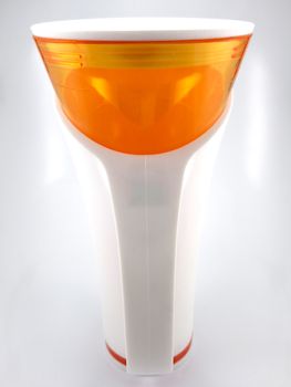 Orange and white color long plastic drinking cup with handle use to drink water content 