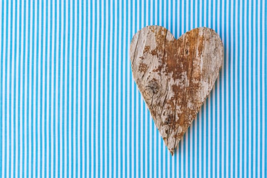 Fathers day background with handmade rustic wooden heart and copy space
