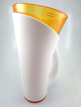 Orange and white color long plastic drinking cup with handle use to drink water content 