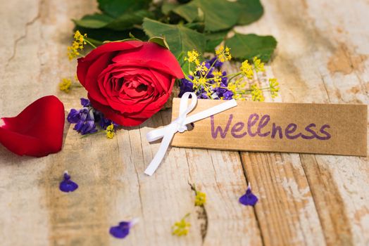 Bunch of flowers with gift card, voucher or coupon for Wellness