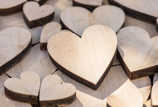 Valentine day background with many wooden love hearts