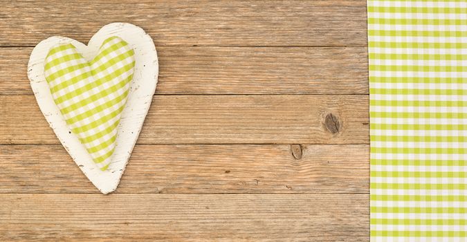 Rustic heart on wooden background with copy space