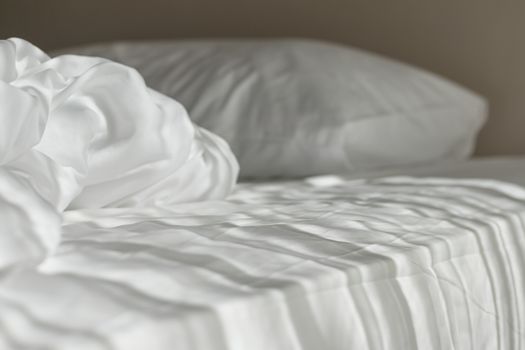 White mattress in the morning with the light lay on the bed.