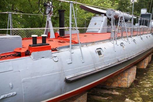 fragment of an old submarine in the park