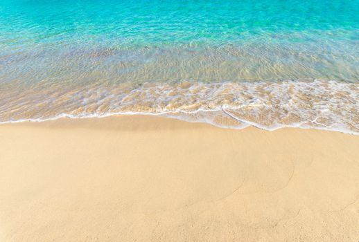 Sand beach with sea wave background texture
