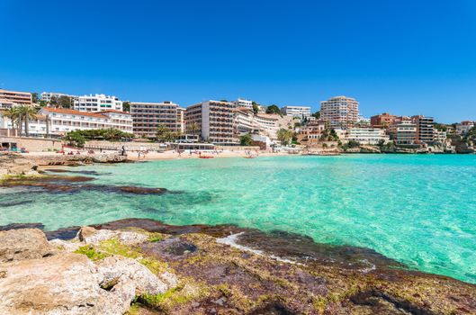 Beautiful beach with urban skyline of Cala Major in Palma de Mallorca, Spain